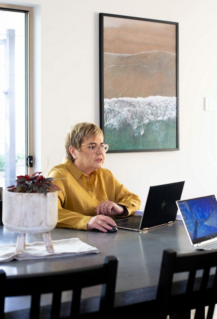 women using laptop in office